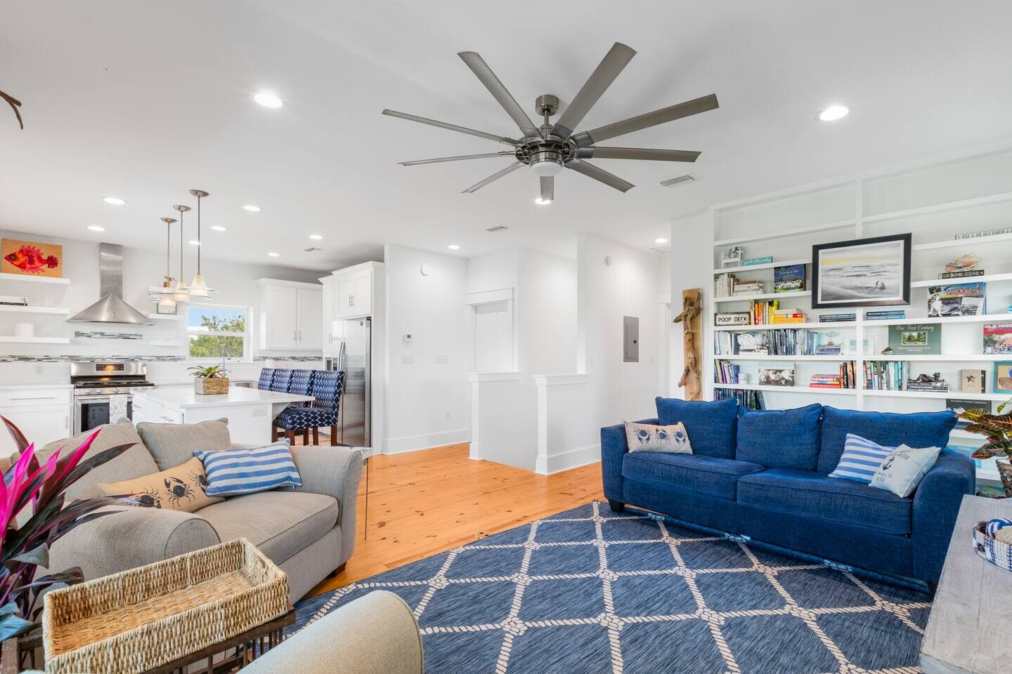 The Seaside Story living room with its full in-house library in Fort Morgan, Alabama
