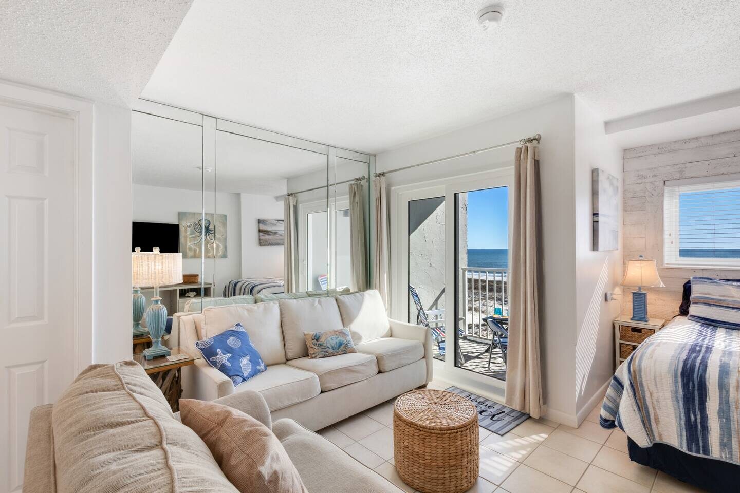 The living area and balcony inside The Seaside Suite